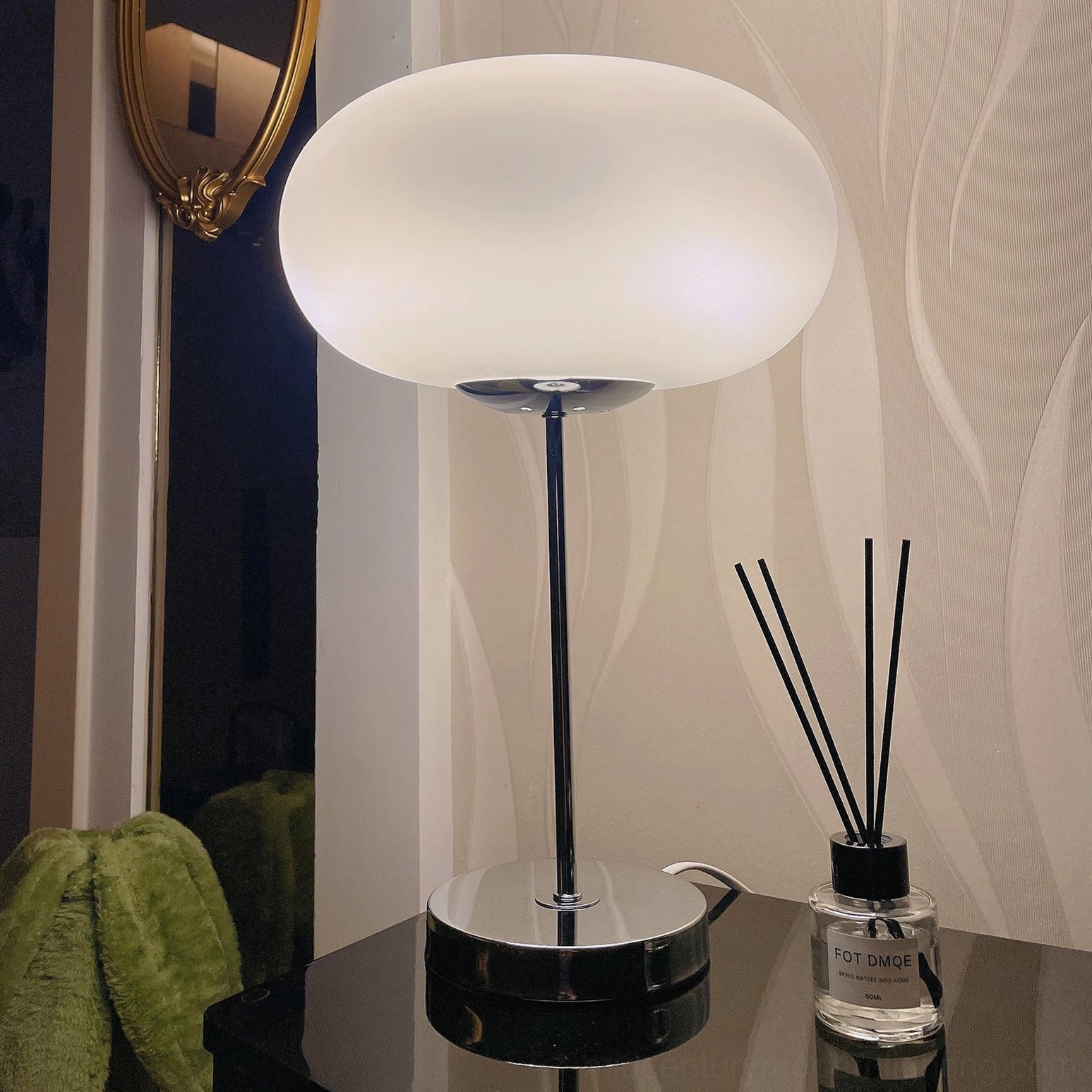 Minimalist silver table lamp with frosted glass shade, contemporary bedroom nightstand styling