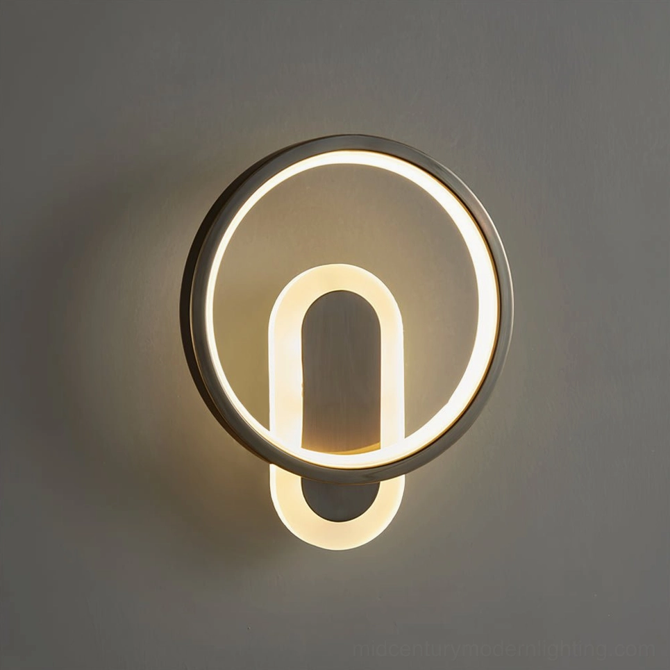 Contemporary minimalist wall lamp available in brass gold and matte black finish options