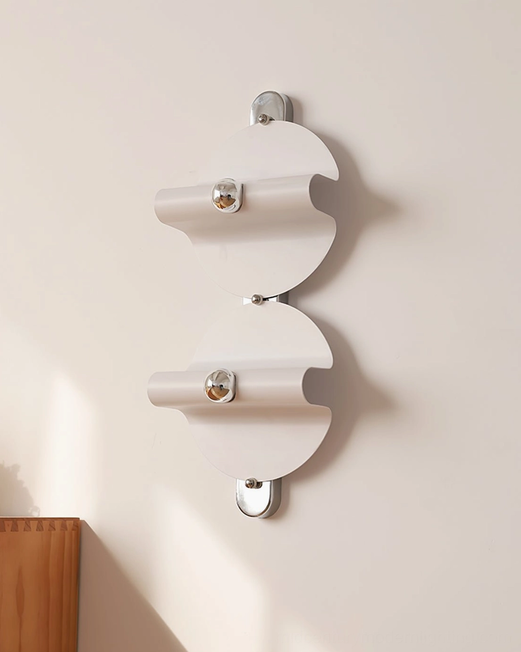 Modern minimalist wall sconce with clean white design and polished chrome accents
