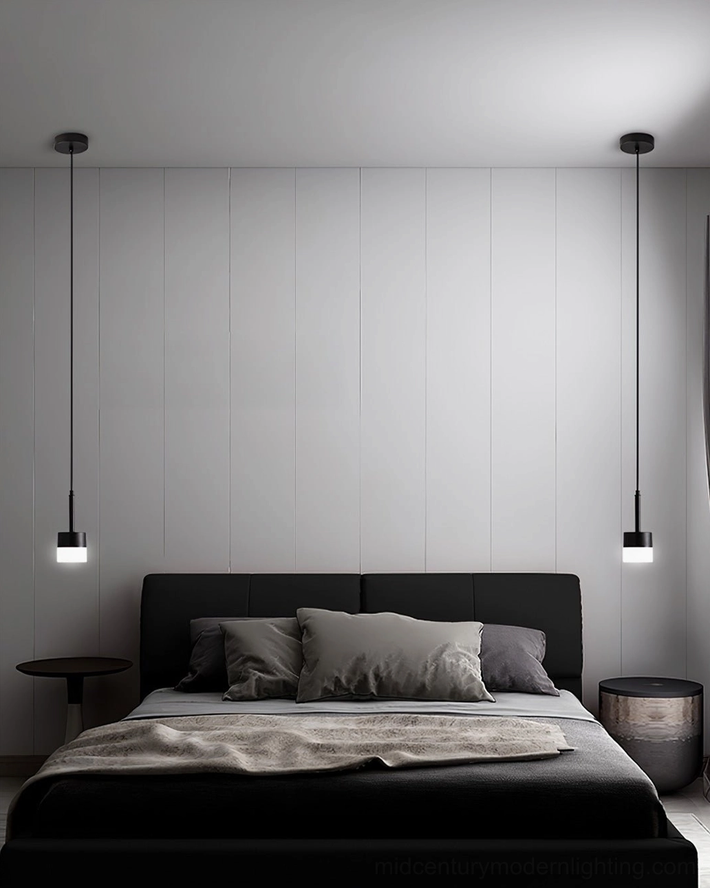 Pair of Mira black pendant lamps symmetrically hung in modern master bedroom with paneled walls