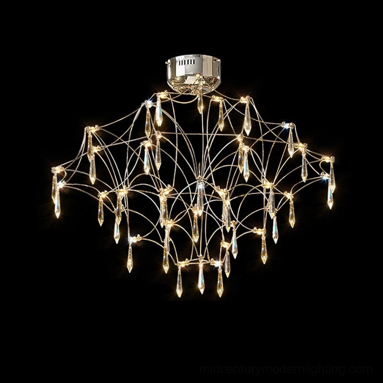 Mira symmetrical tiered crystal chandelier with uniform design and polished silver metal finish, front direct view on black backdrop