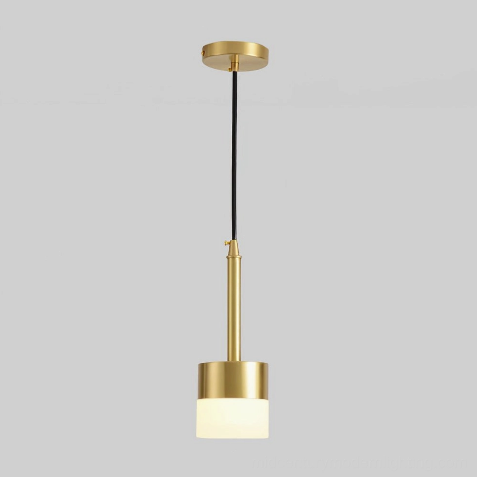 Mira gold pendant lamp suspended over dining table creating intimate ambient lighting effect