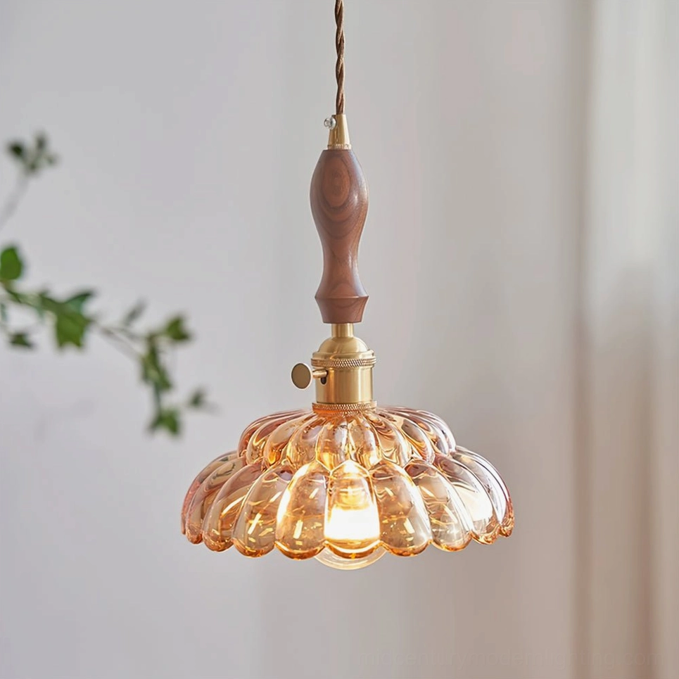Amber fluted glass pendant lamp hanging indoors with sheer curtain and green foliage, farmhouse retro lighting style