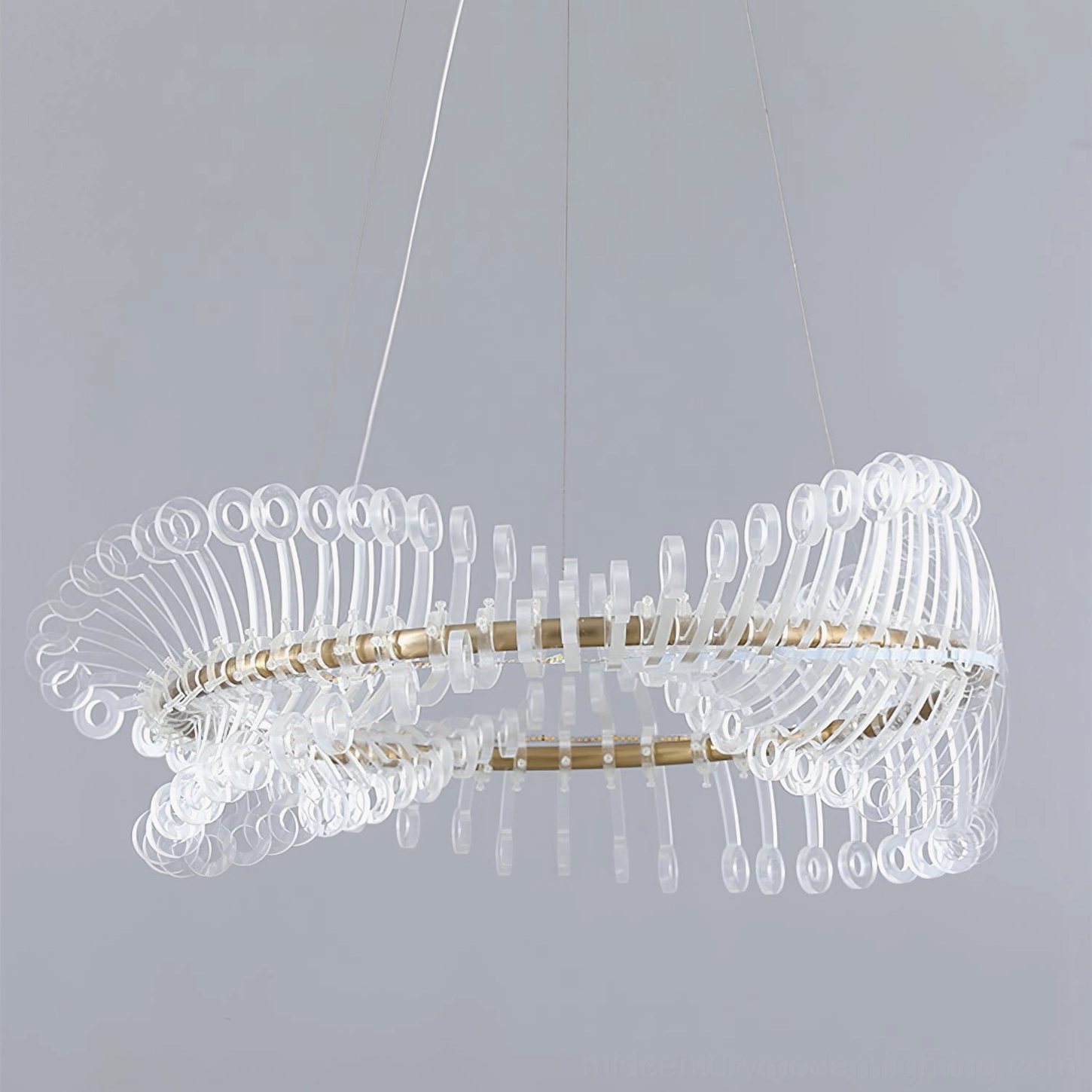 Modern gold Möbius strip chandelier left profile view showing clear acrylic pendants and brass support ring
