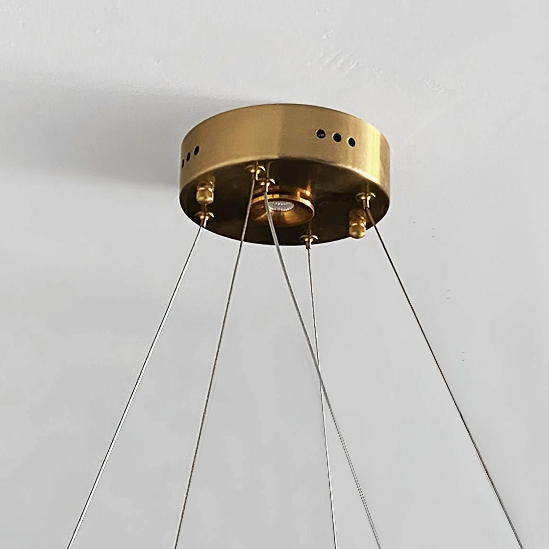 Contemporary Möbius crystal chandelier size comparison across petite, medium, and large options