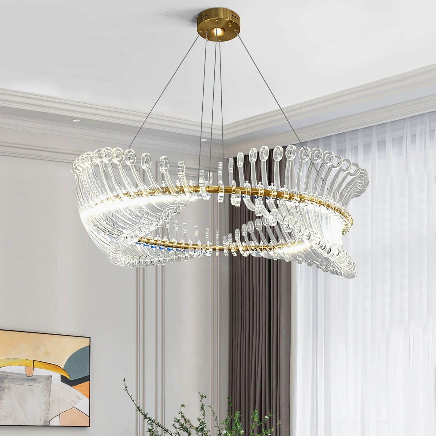 Modern Möbius crystal chandelier close-up showing brass inner support ring and clear glass elements
