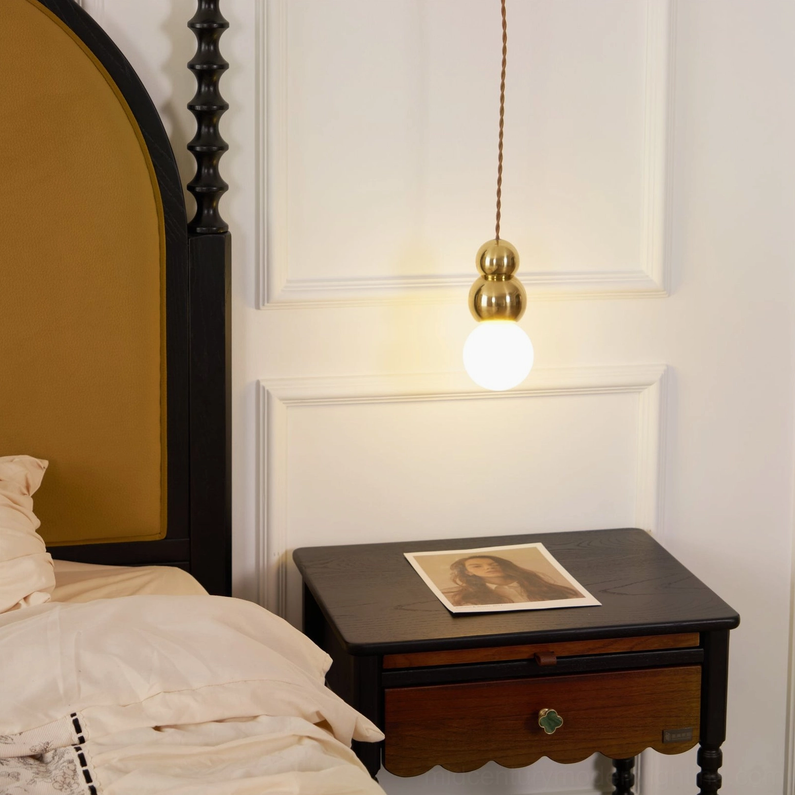 Modern ball wall sconce in residential interior, warm lighting ambiance, contemporary home design