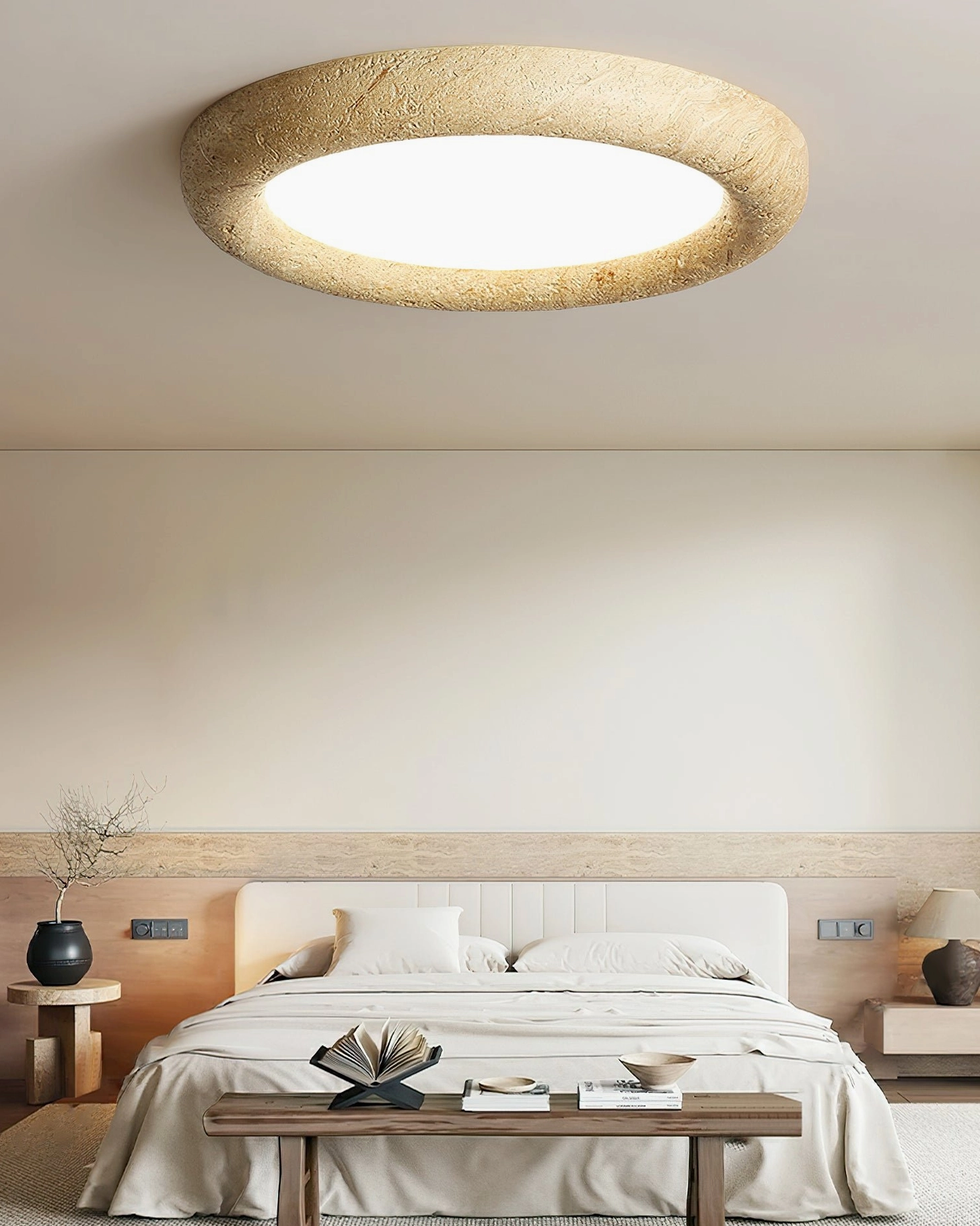 Minimalist ceiling light installed in modern bedroom with neutral bedding and warm ambient lighting