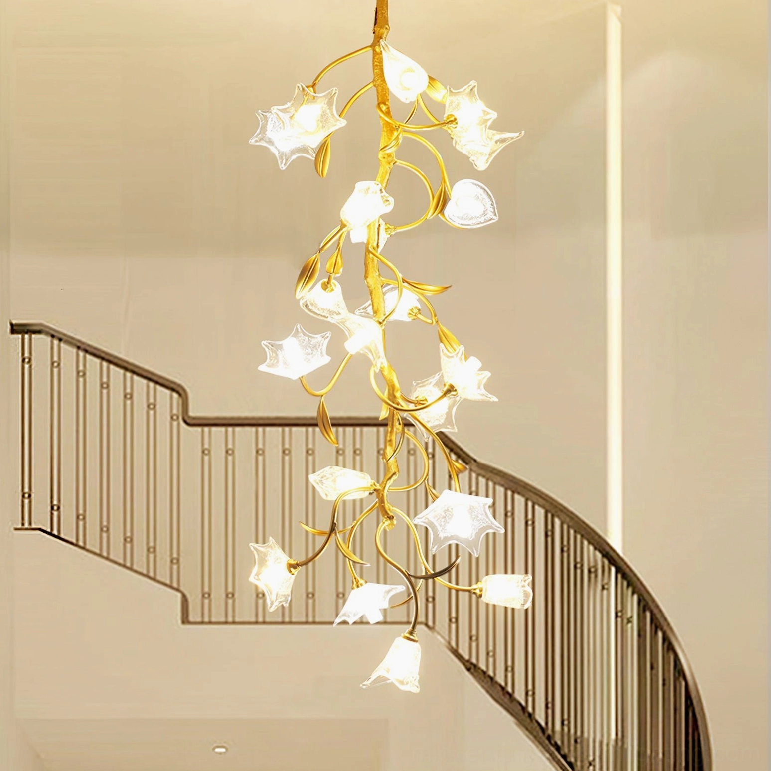 Modern botanical chandelier suspended in curved metal railing stairwell with minimalist luxury home decor
