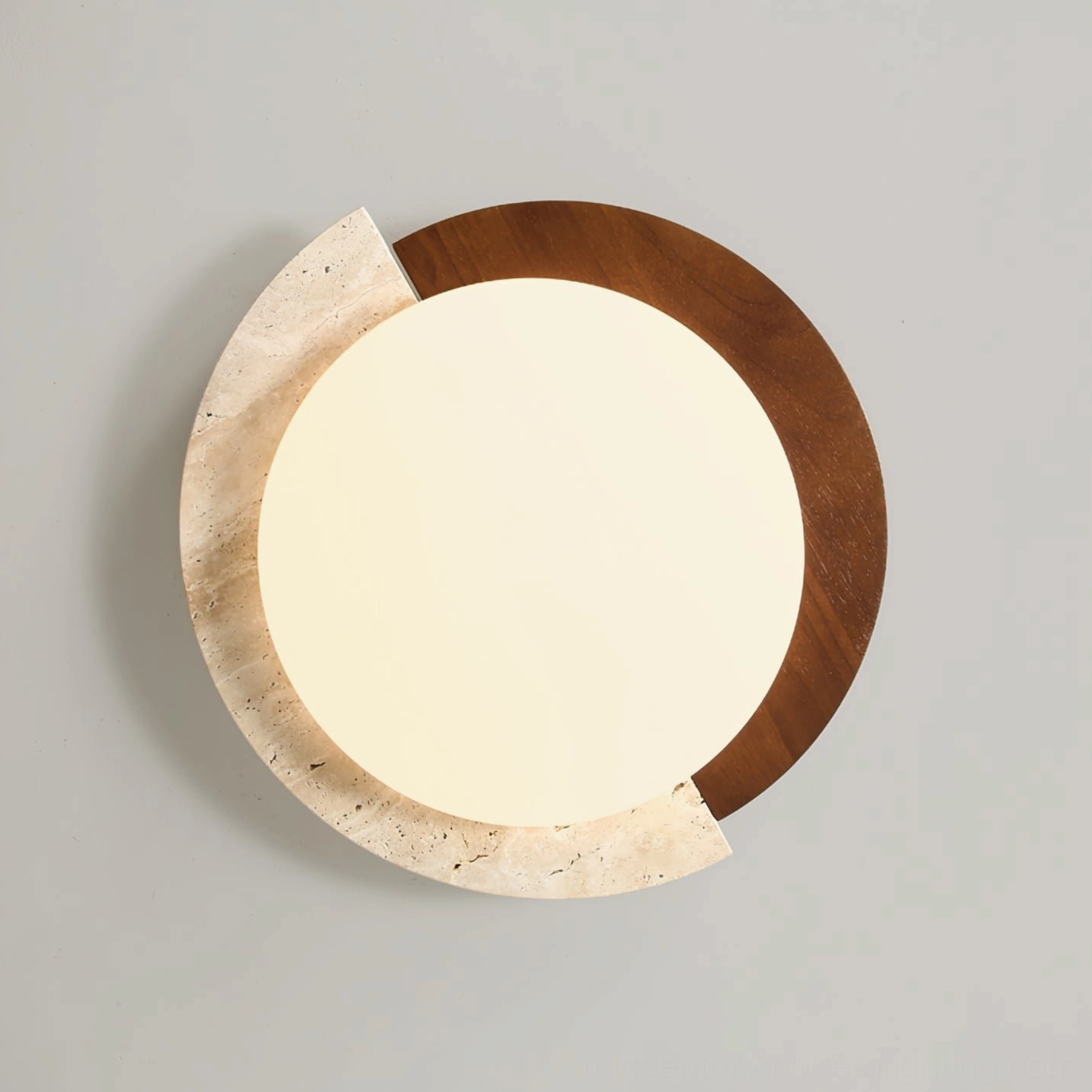Overhead shot of modern asymmetrical ceiling lamp with travertine accent panel and round acrylic diffuser on gray wall