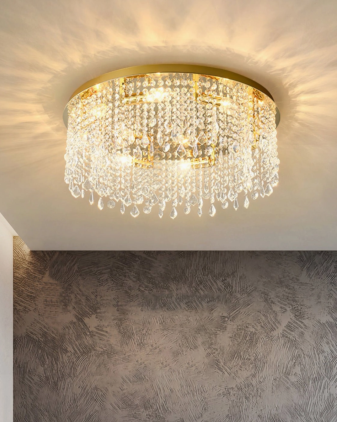 Modern accent wall room with installed gold crystal flush mount ceiling lamp with dense clear crystal tassels