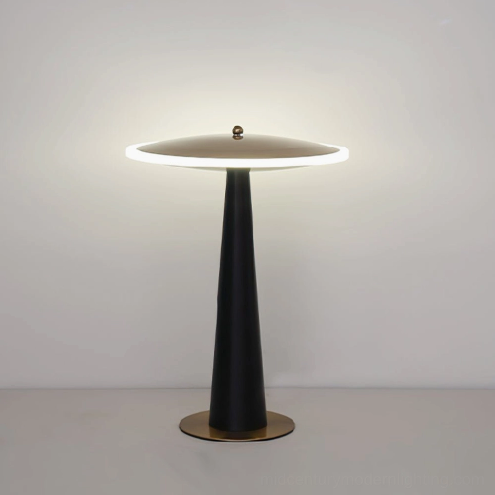 Modern disc table lamp with warm LED light against neutral white wall background