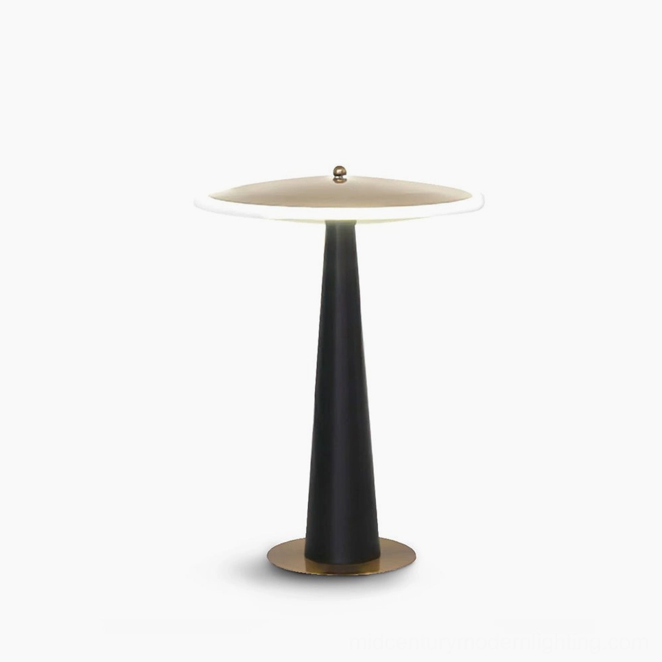 Drums disc table lamp with matte black pole and polished gold base, studio front view