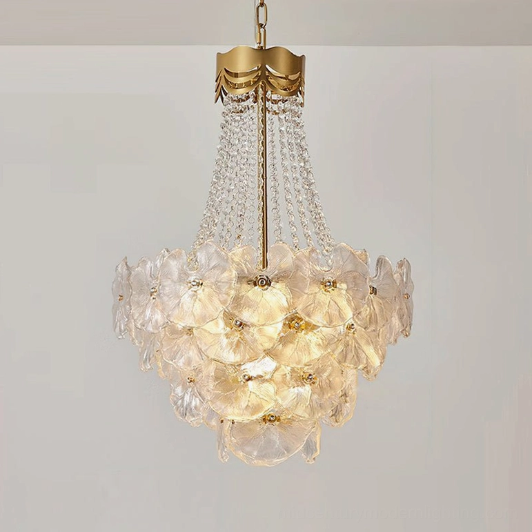 Modern glam crystal chandelier featuring geometric flower-shaped glass formation and luminous crystal strands