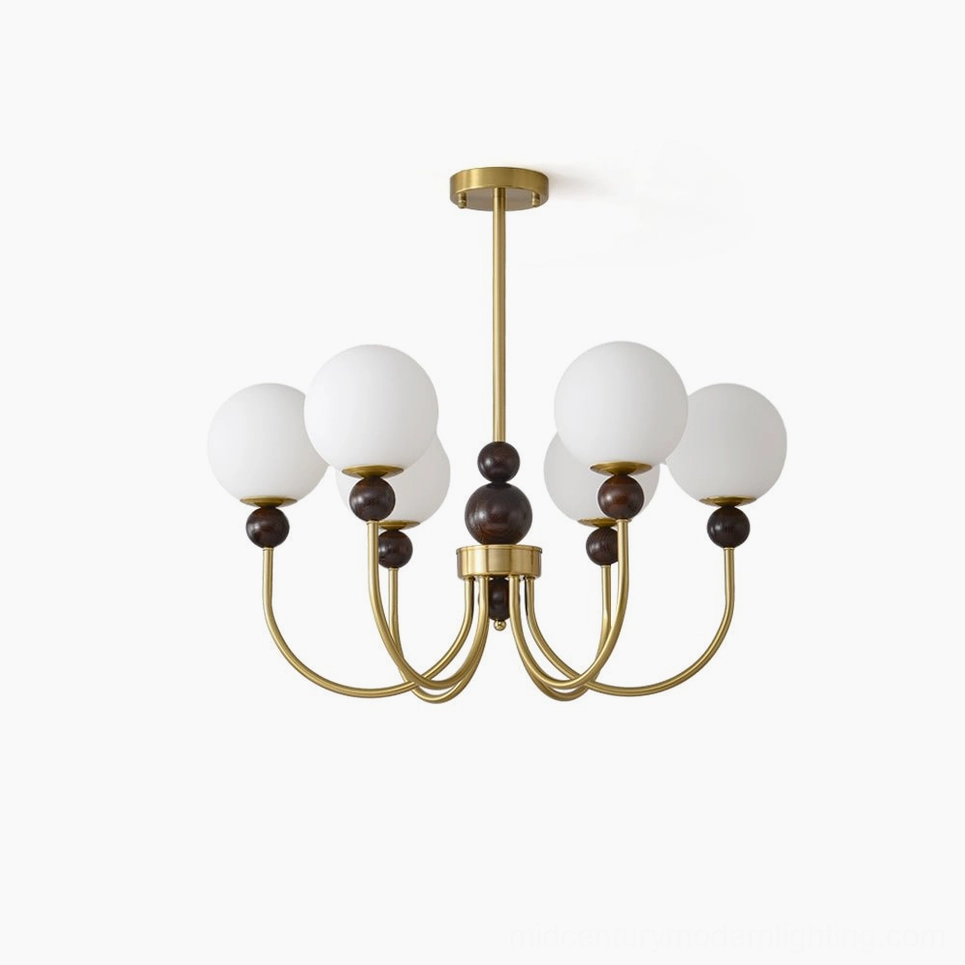 Modern glass pendant chandelier with brass metal frame and frosted white spherical shades, front view on white background