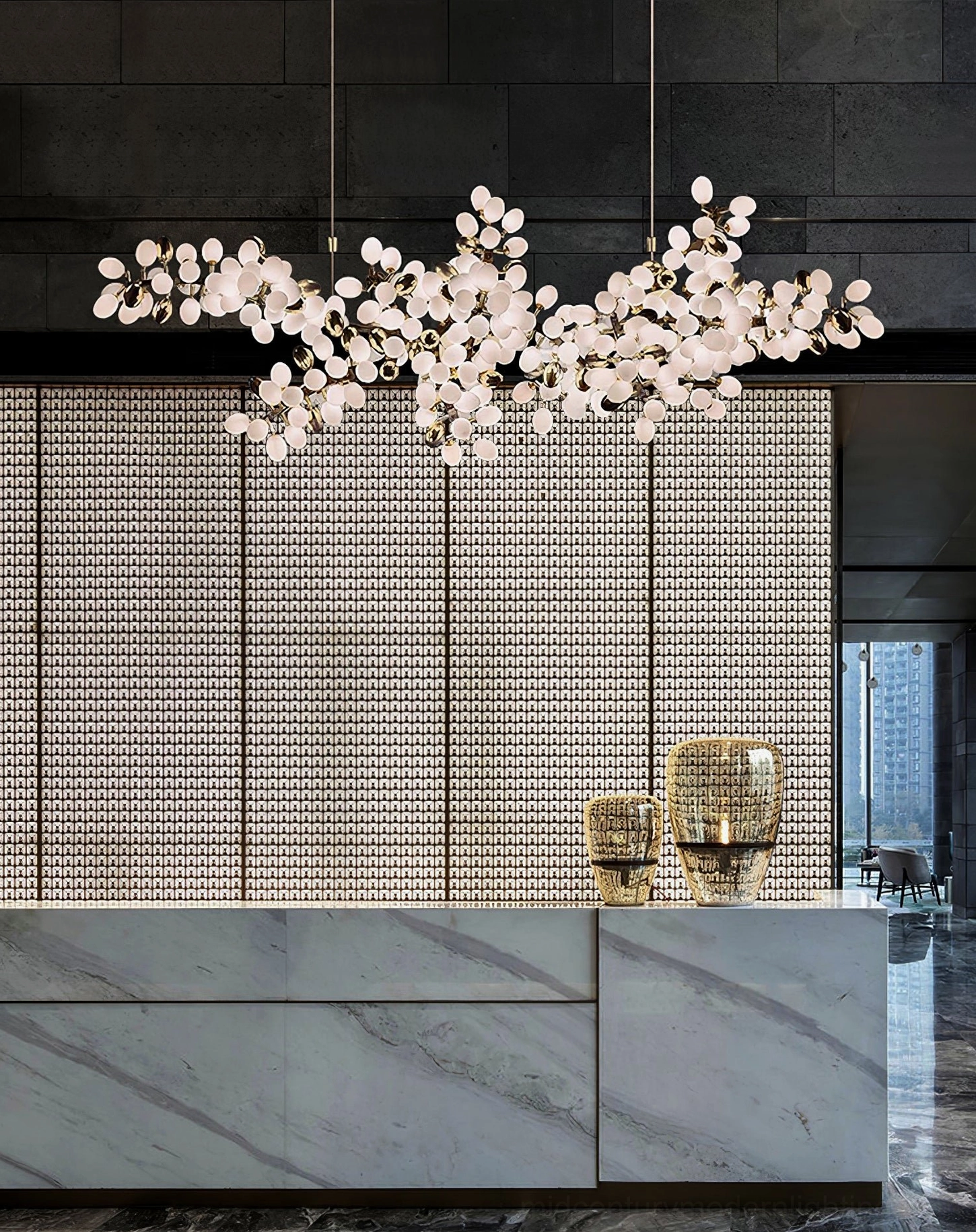 Modern grape vine chandelier with frosted glass shades and warm brass metal vine design