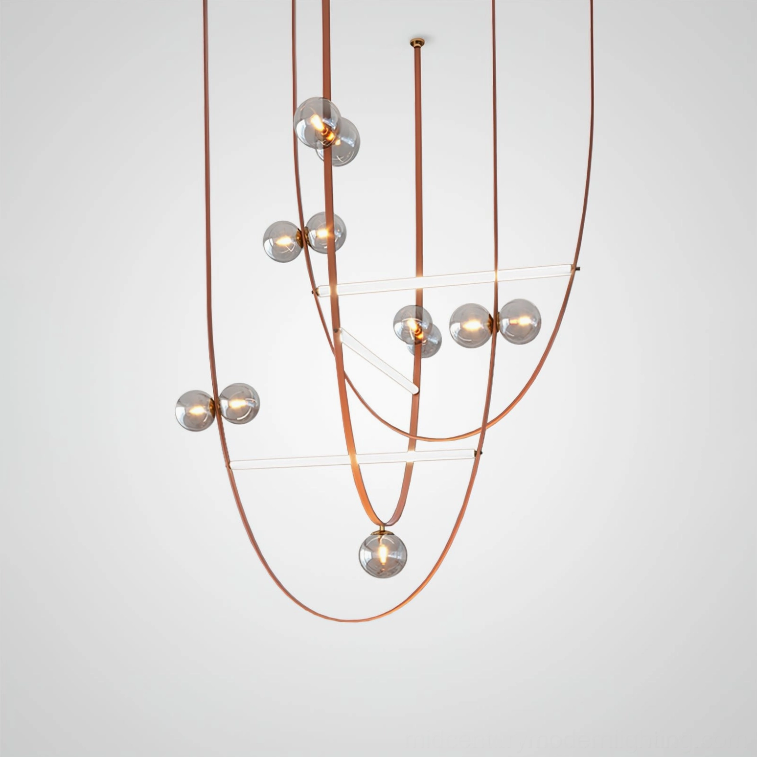 Overhead view of multi-strand modern leather pendant lighting fixture with curved brown leather cords and staggered glass orbs