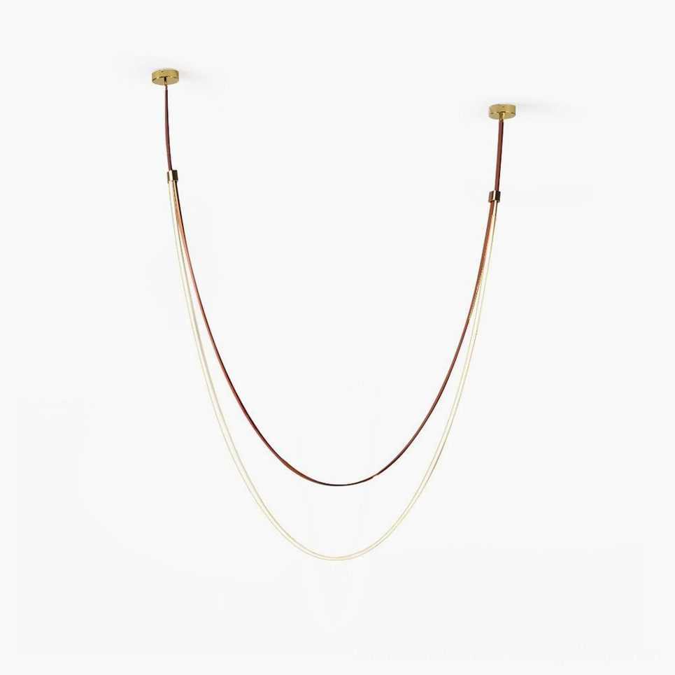 Minimalist sculptural leather pendant lamp with dual-tone strap design and gold ceiling fixtures on white background