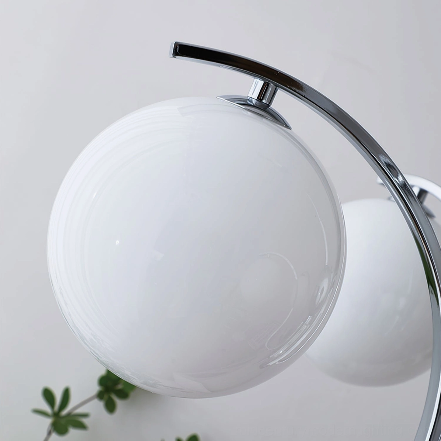 Modern minimalist glass globe chandelier with white frosted shades and polished hardware