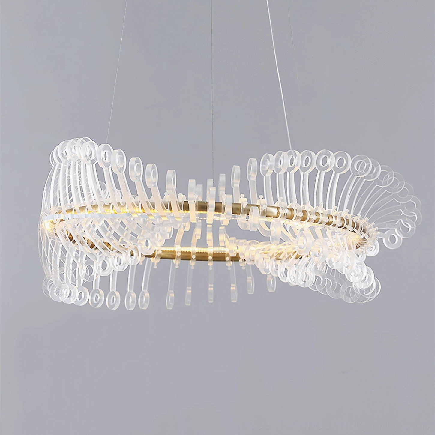 Elegant Möbius gold chandelier right side view with illuminated warm light and delicate glass accents