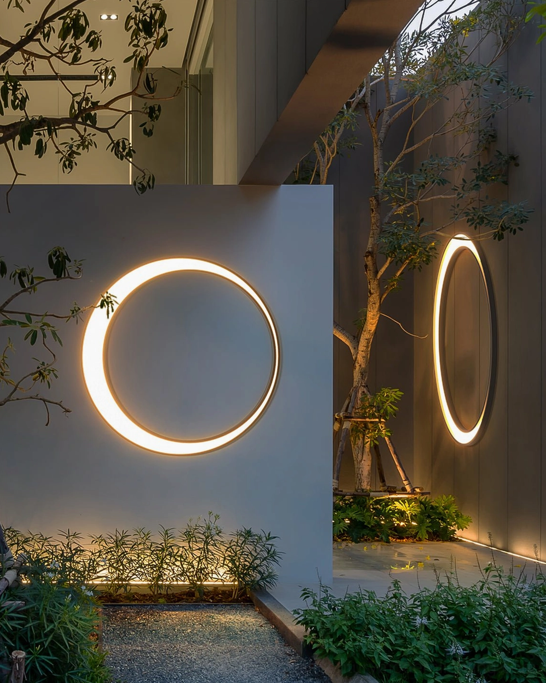 Contemporary moon ring outdoor wall lamp side view residential exterior