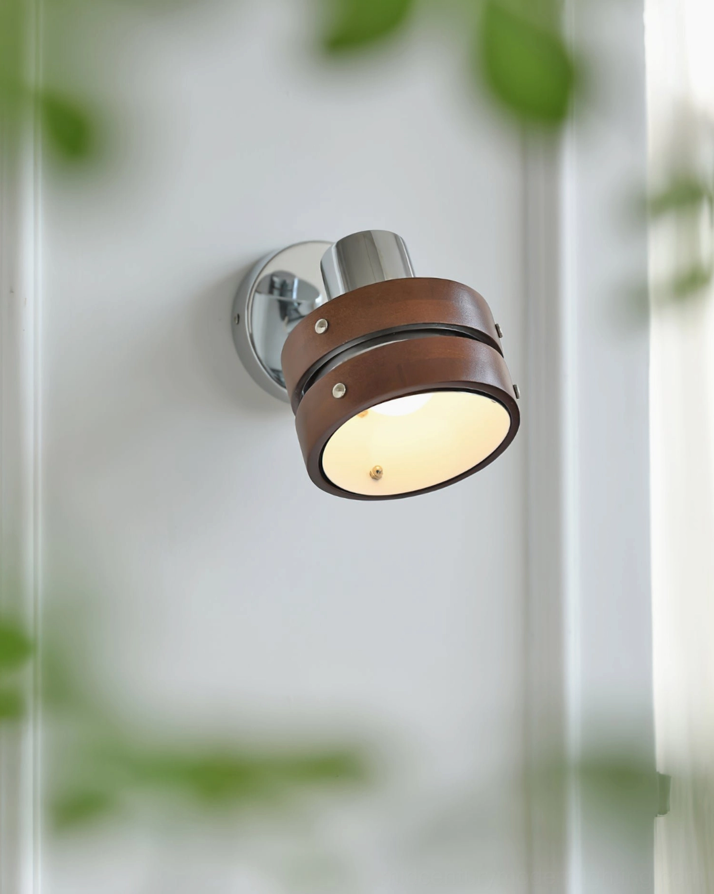 Contemporary mid-century sconce with rotatable head in modern home office
