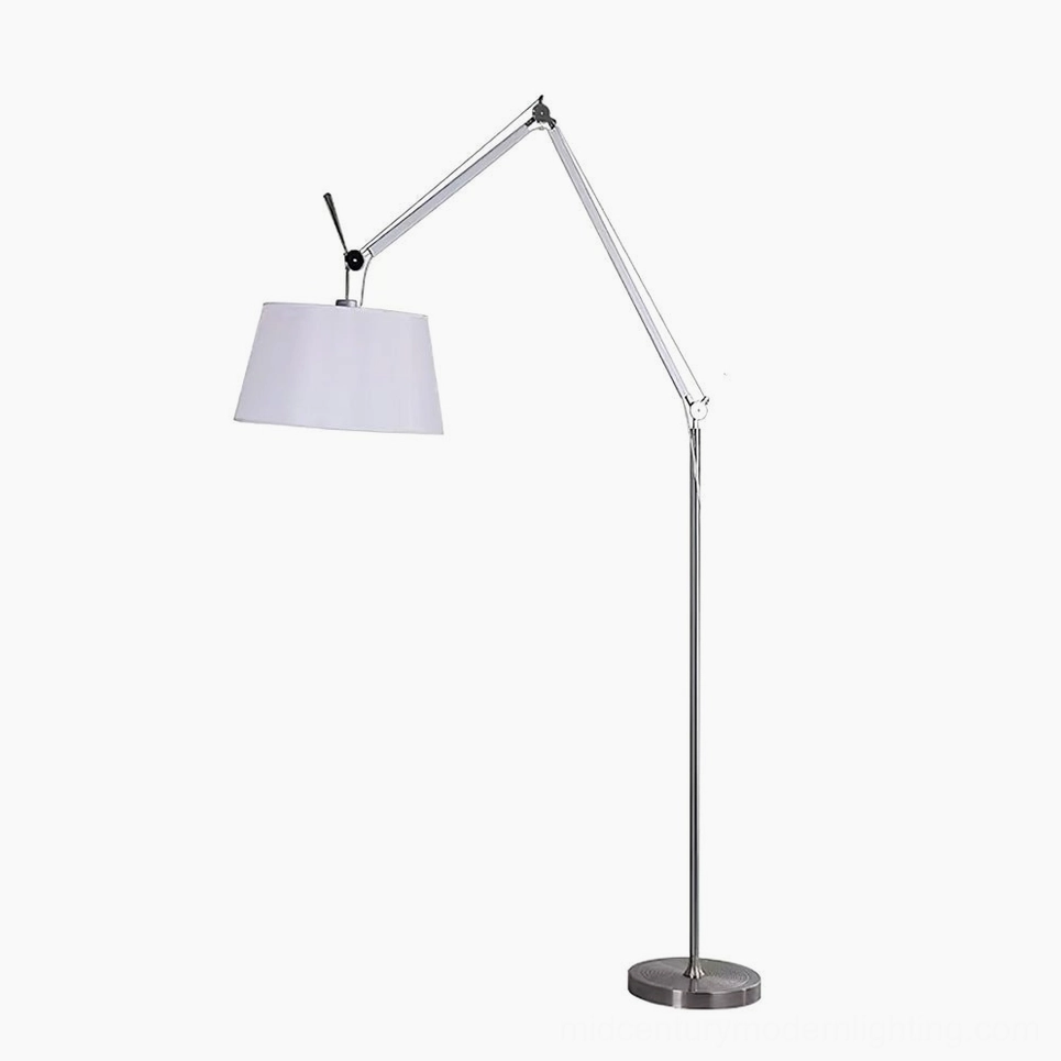 Modern swing arm floor lamp with extended articulating arm, silver metalwork and white drum shade design