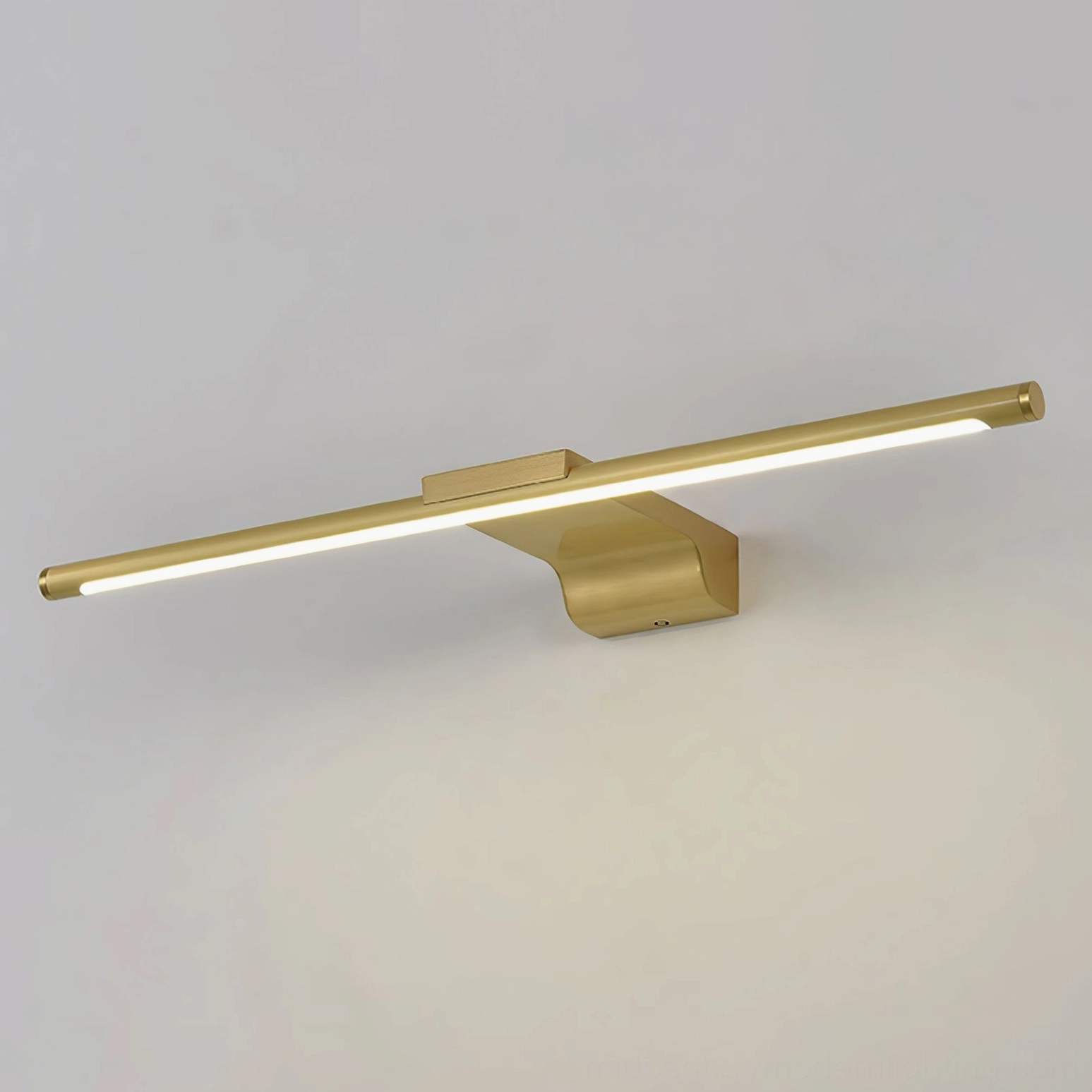 Modern wall lamp with warm brass tone and minimalist linear design profile