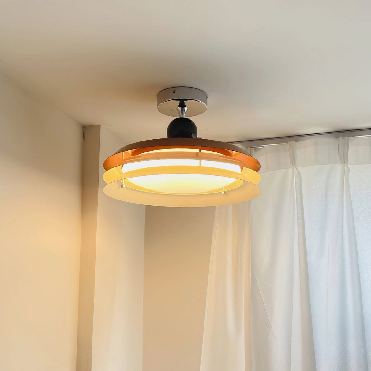 Moers ceiling lamp installed in bedroom with sheer curtains casting warm amber-brown light creating ambient bedroom lighting
