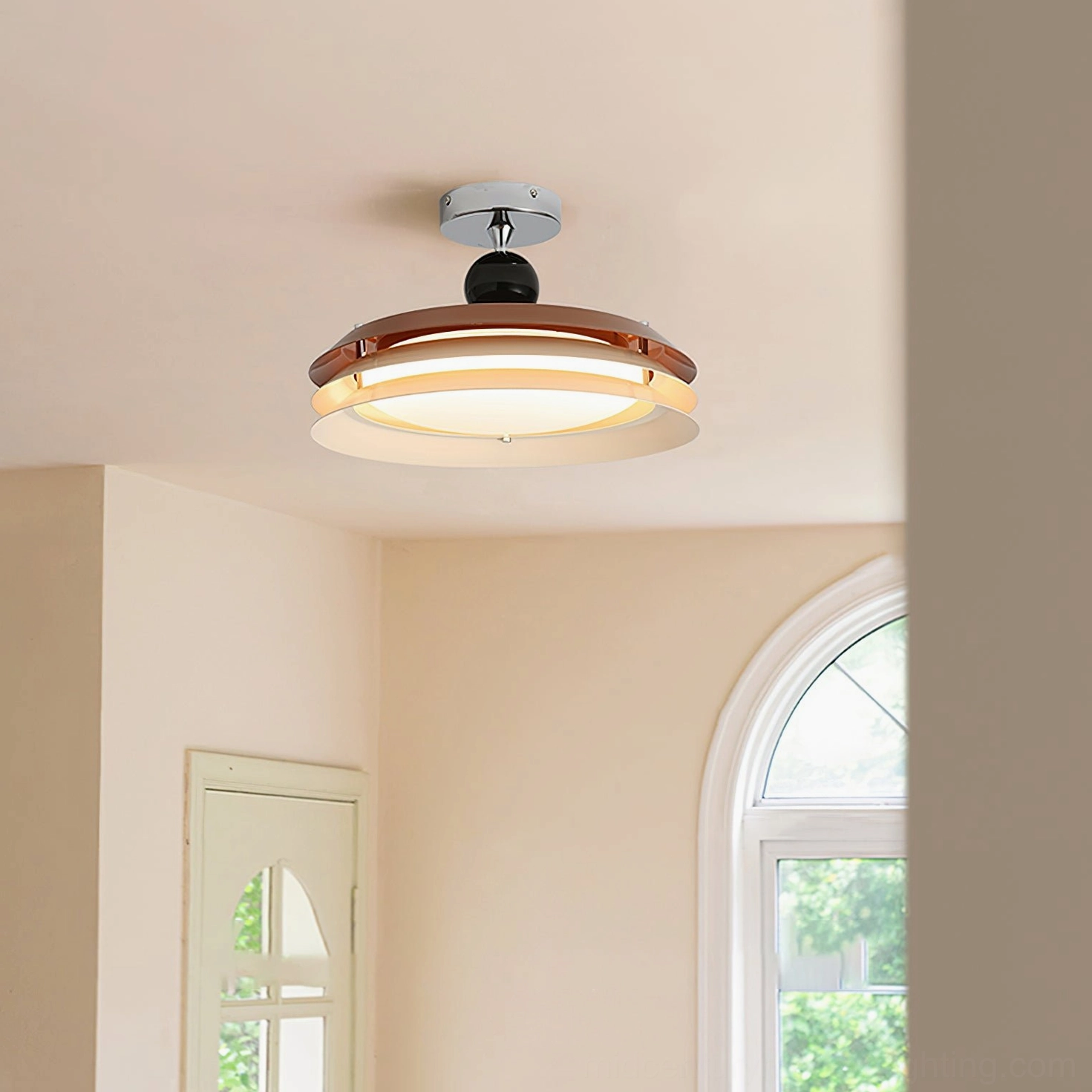 Modern ceiling lamp installed in residential room with arched window showing compact dark brown dual-layer design