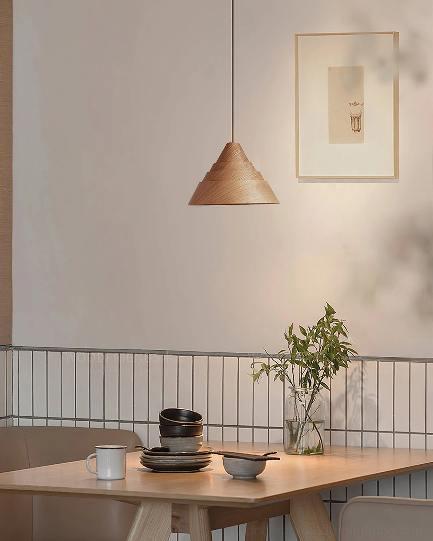 Single simple conical wooden pendant lamp with natural light wood finish in cozy small cafe dining area with neutral decor
