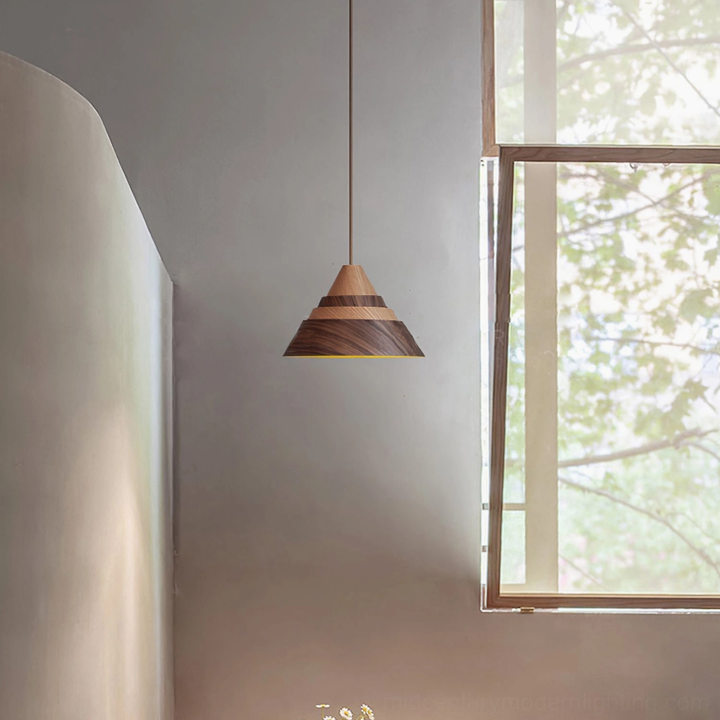 Moku wooden pendant lamp hanging in bright minimalist room with outdoor greenery view, Scandinavian interior design