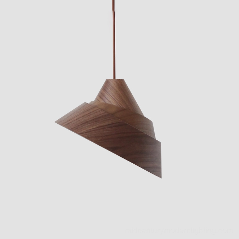 Small-scale Moku wooden pendant light with natural wood finish in minimalist room setting with Nordic design elements