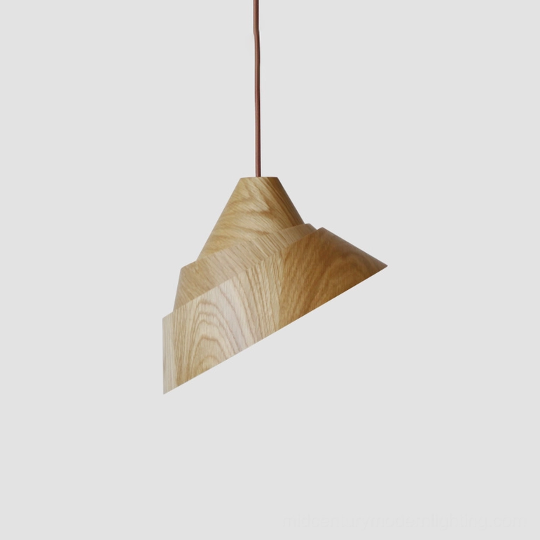 Small Moku wooden pendant light suspended over intimate dining space, natural wood finish with warm ambient glow
