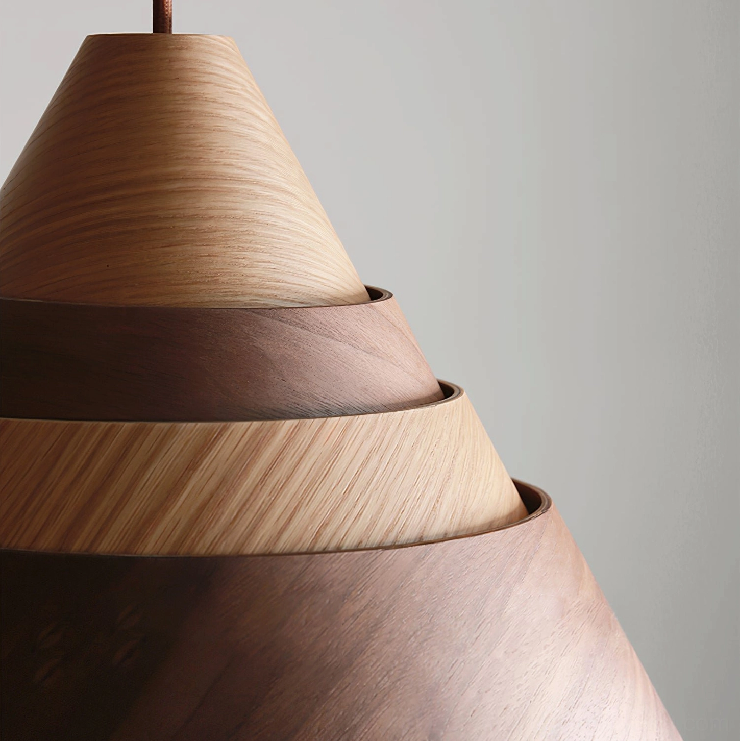 Walnut wood Moku pendant lamp showcasing rich chocolate grain and matte black metal accents in modern interior