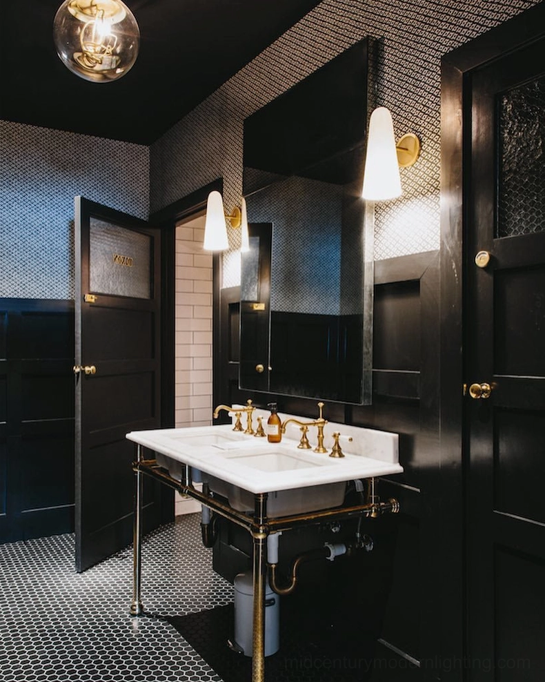 Montfaucon wall sconce with frosted glass shade creating soft diffused illumination on wall