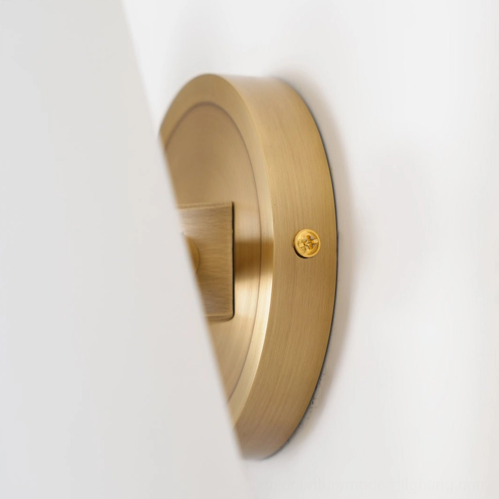 Single Montfaucon mid-century sconce mounted on wall showing sculptural profile and light quality