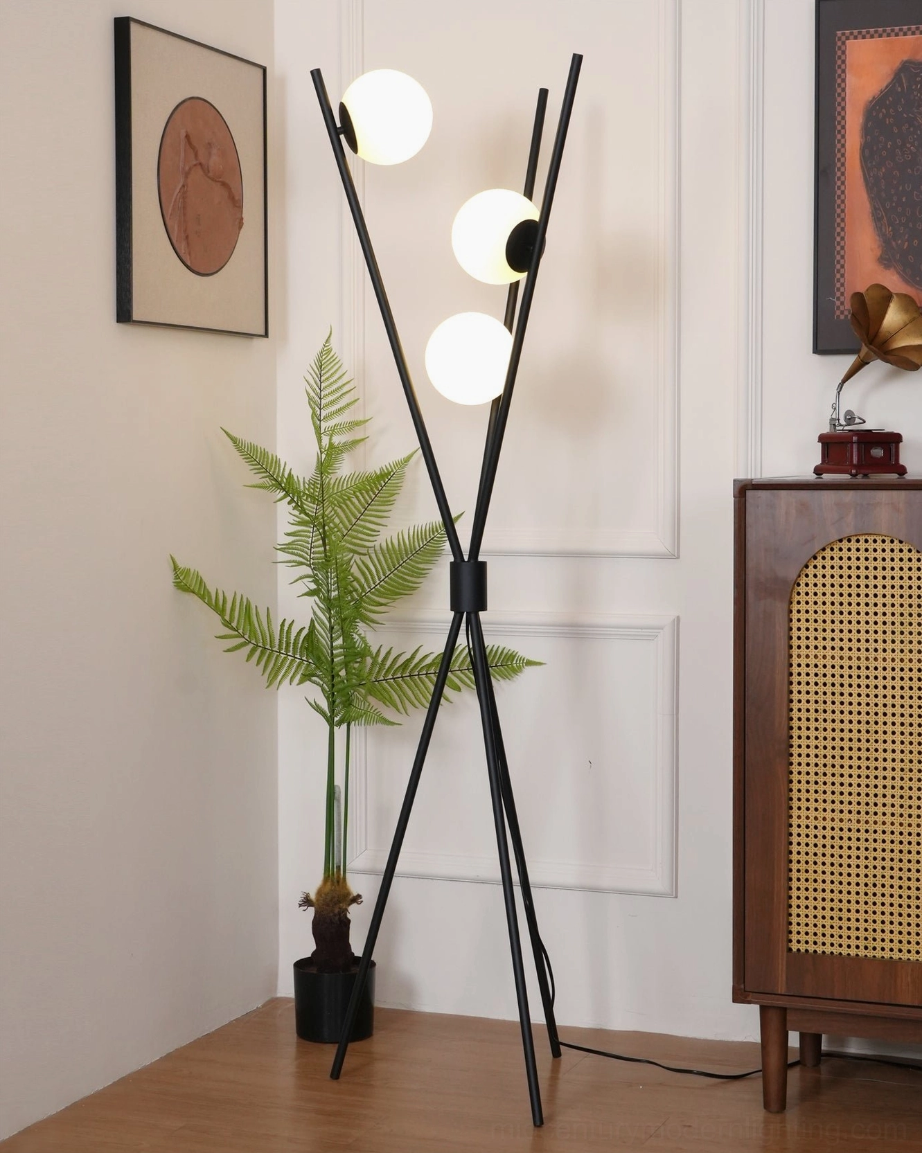 Unlit Moon Tripod Floor Lamp showcasing branch-style black metal rod structure with three frosted white shades