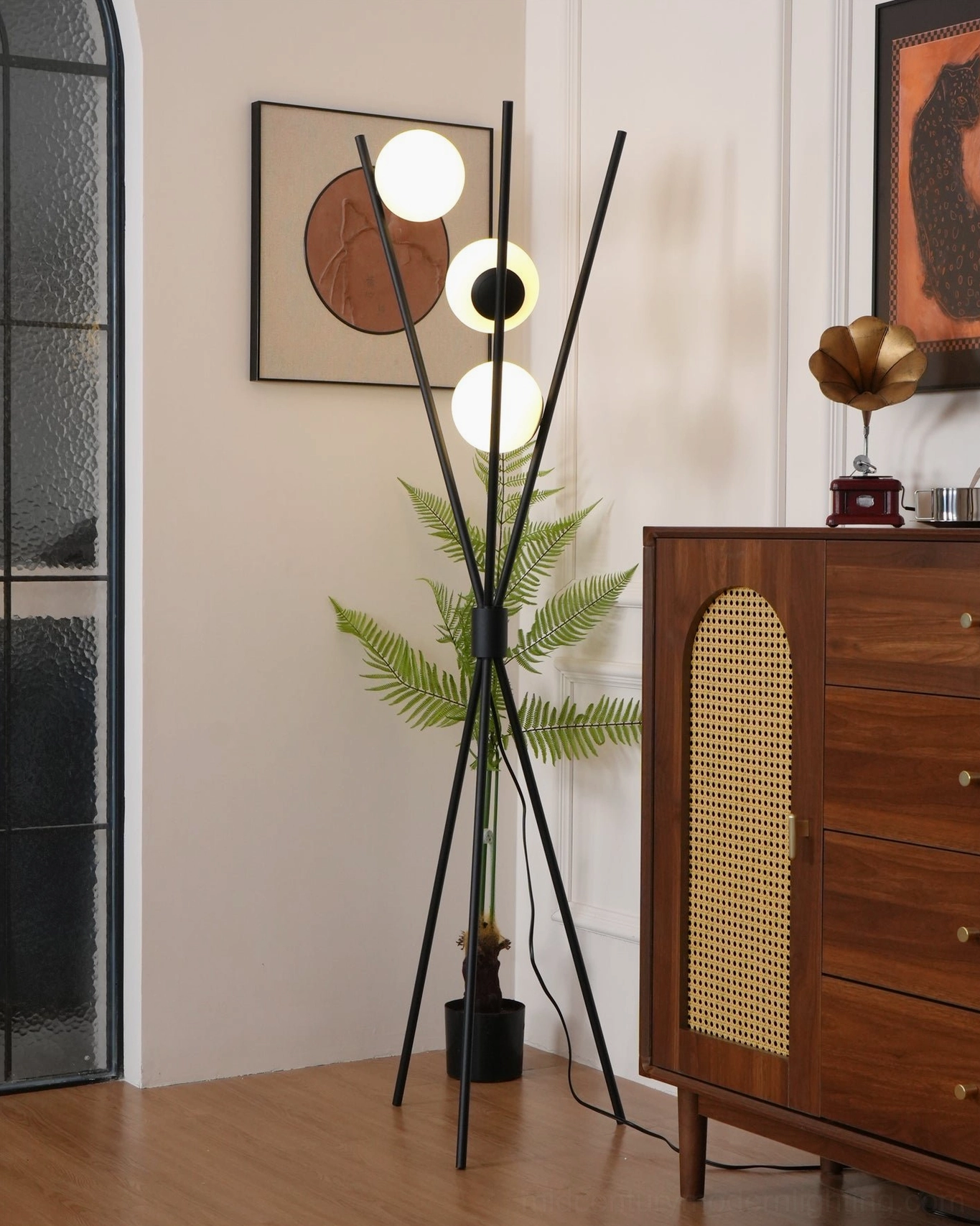 Lit Moon Floor Lamp in hallway with warm illuminated glass globes against vintage decor