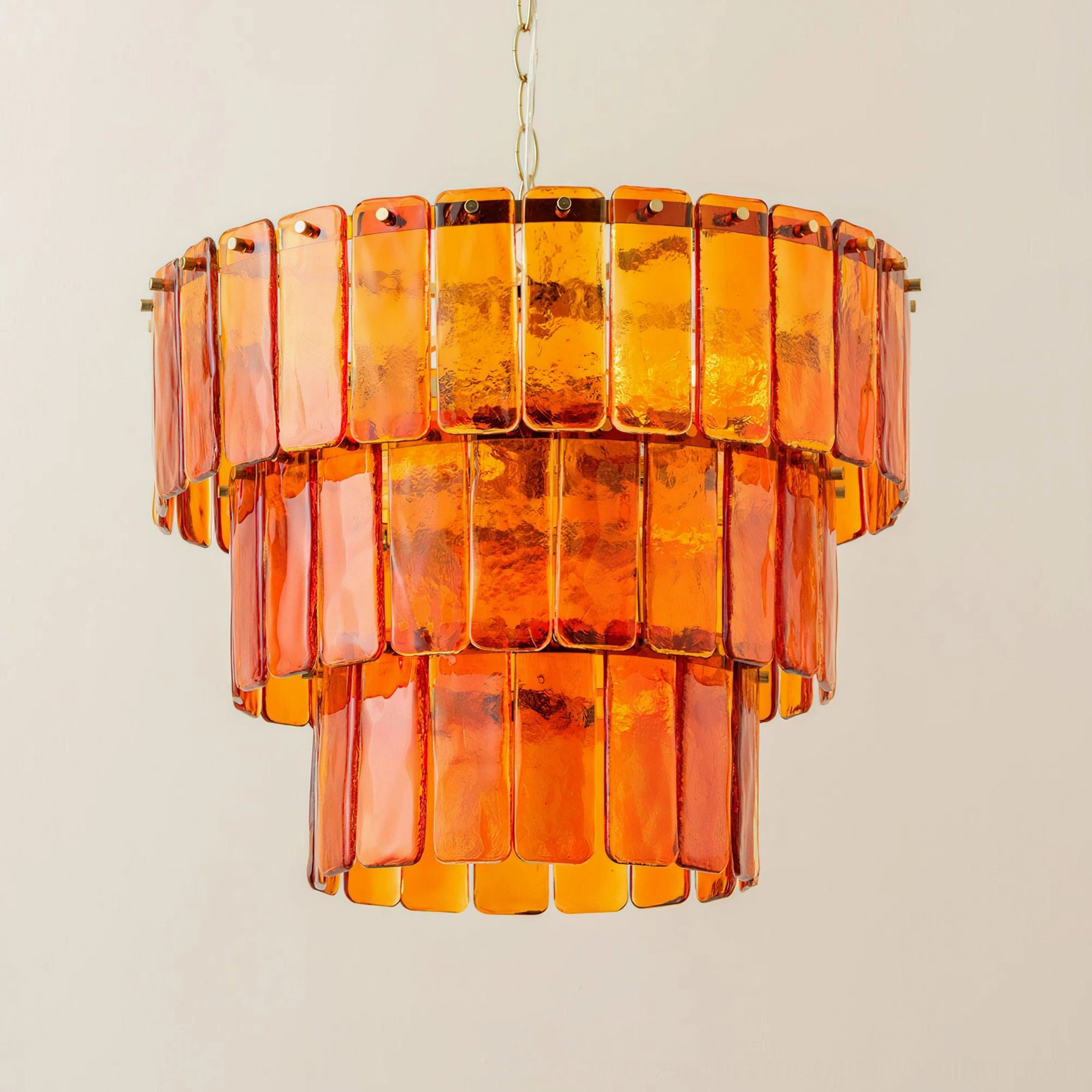 Moreland tiered amber glass chandelier detail showing textured glass panel craftsmanship