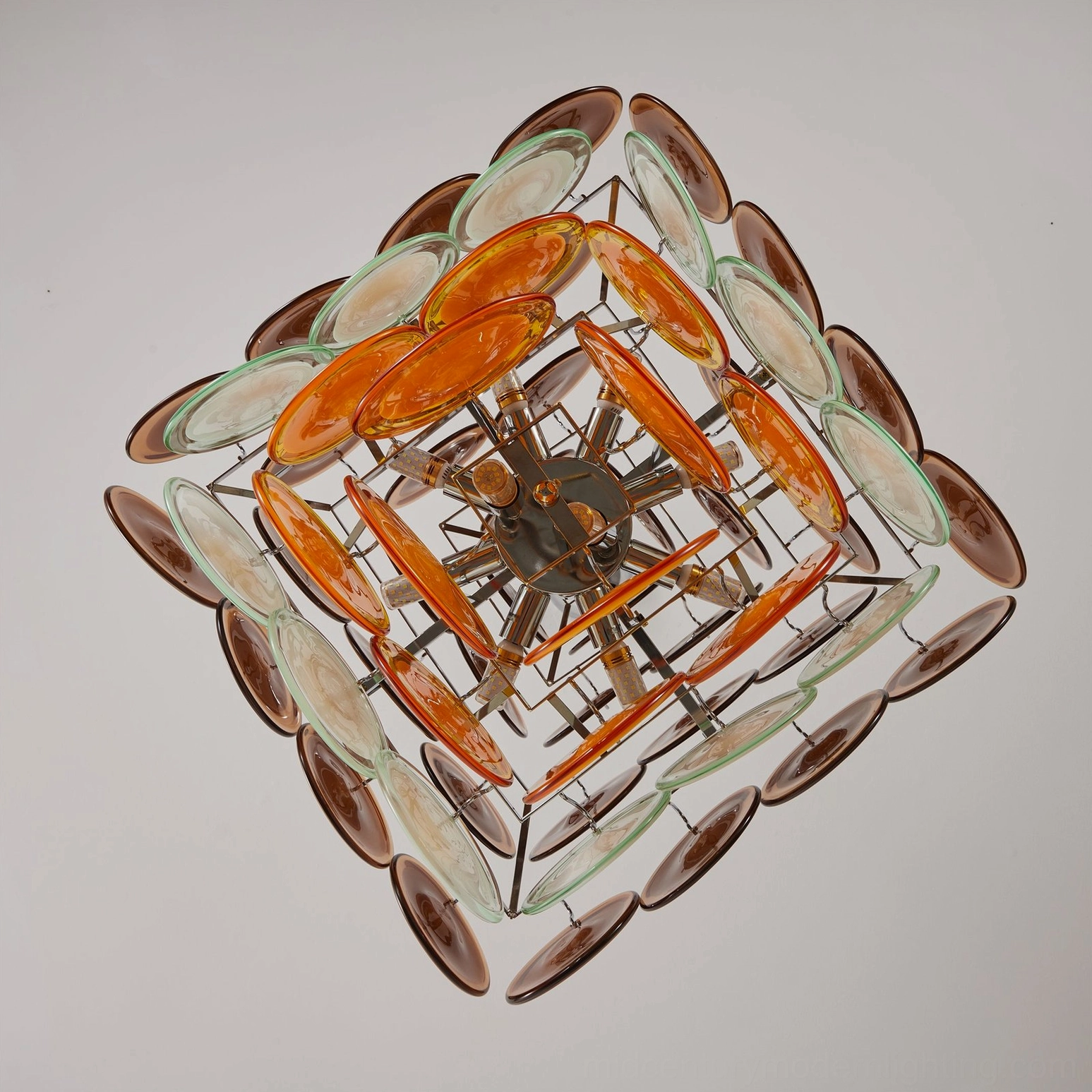 Interior structure overhead view of Mortimer chandelier displaying star-shaped metal base and decorative glass layers
