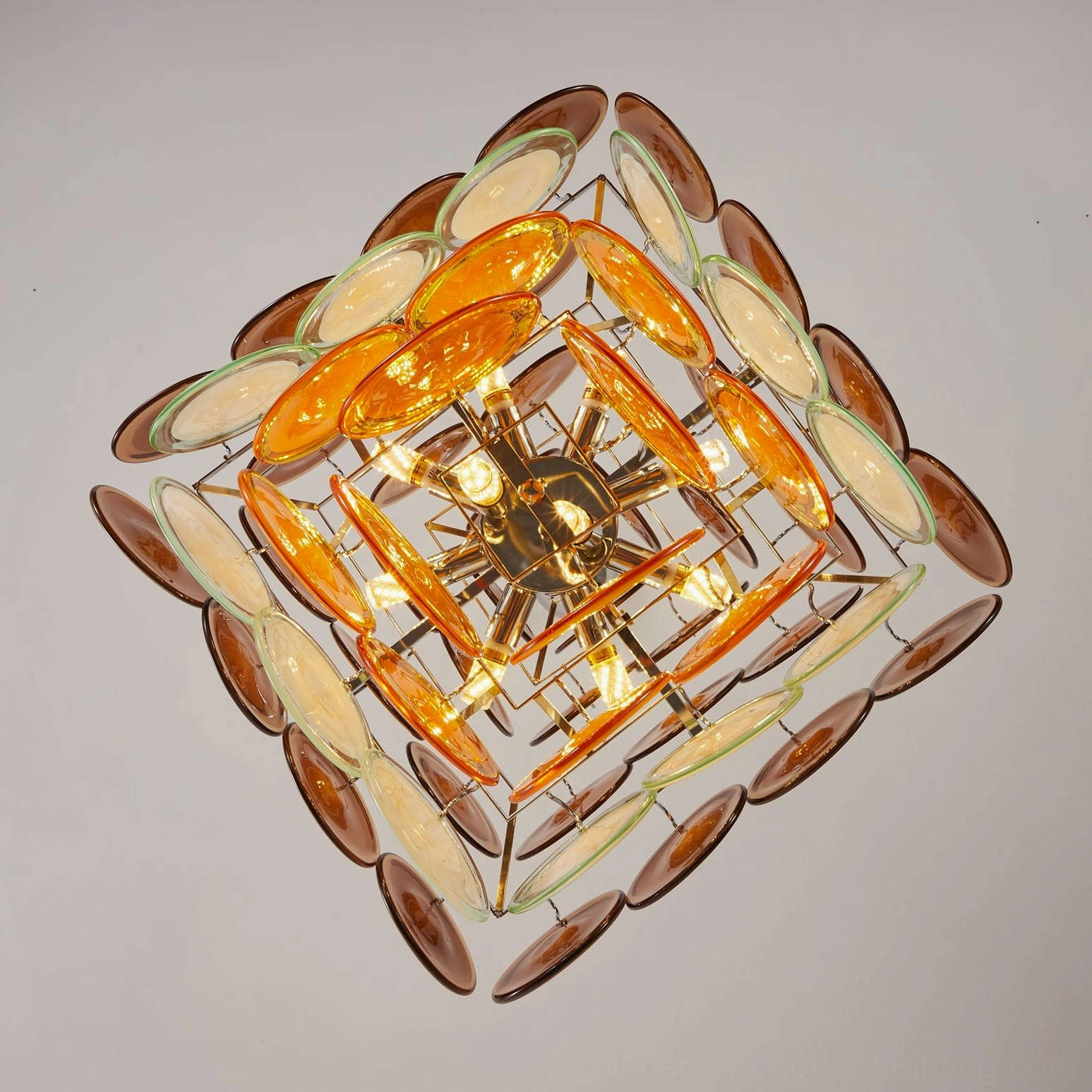 Mortimer chandelier overhead view revealing star-shaped metal frame and layered glass disc construction