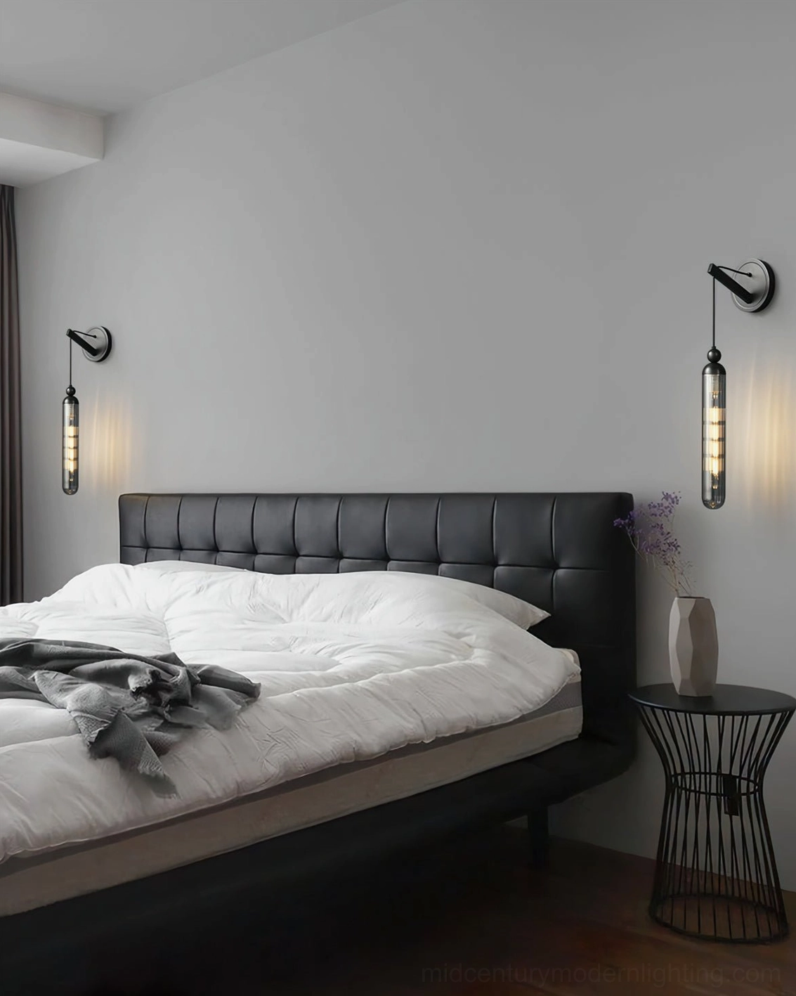 Dual Mullan wall lamps in black and brass finishes in modern master bedroom two-tone lighting design