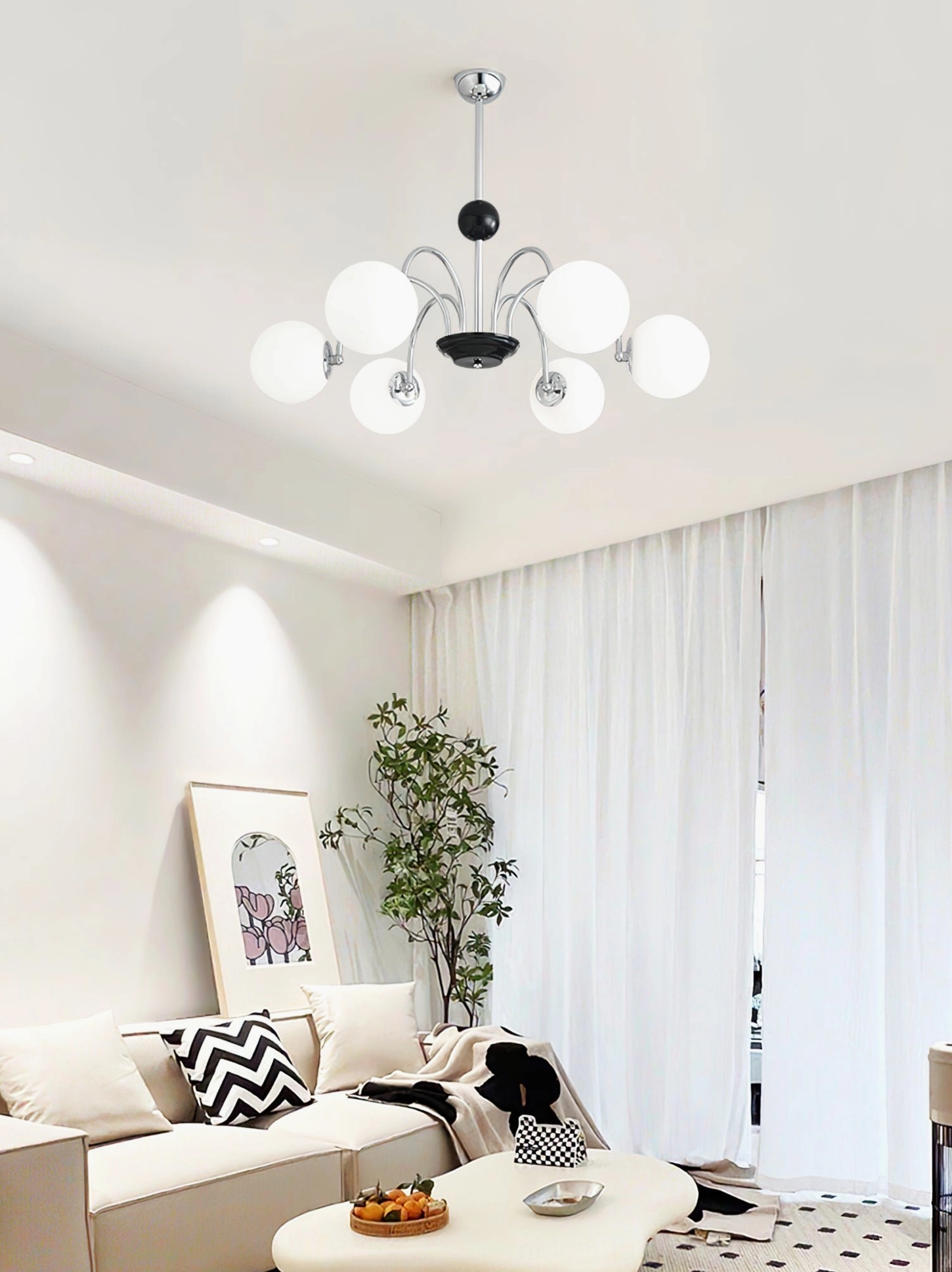 Multi-globe chandelier with silver-black metal frame and frosted glass in contemporary living room with sofa