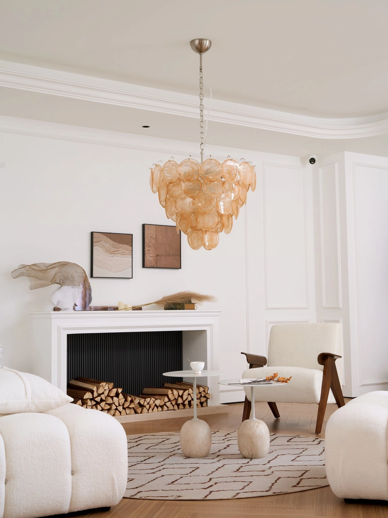 Murano caramel disc chandelier in bright white contemporary living space above fireplace decor