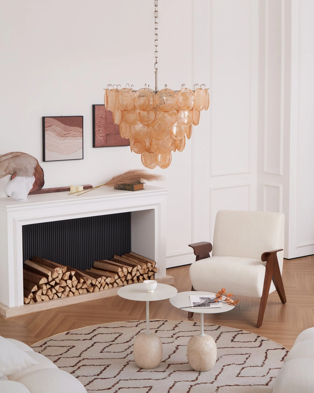 Murano caramel disc chandelier installed in modern minimalist living room above lounge seating area