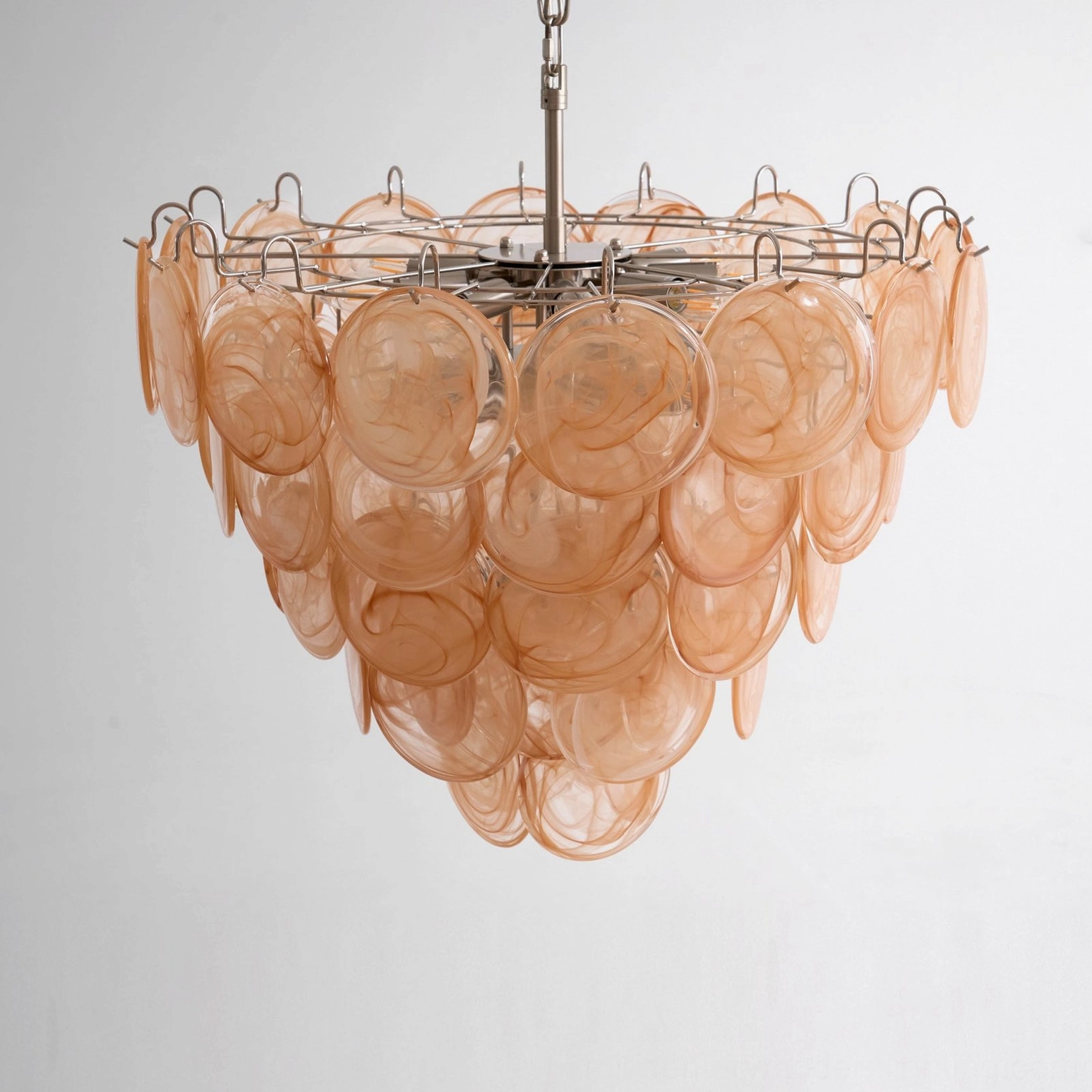 Murano caramel disc chandelier top-down view exposing metal frame and glass disc layering