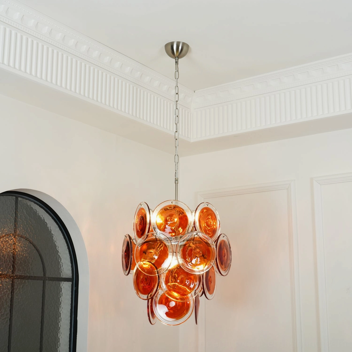 Murano glass disc chandelier ambient light diffusion orange amber glow
