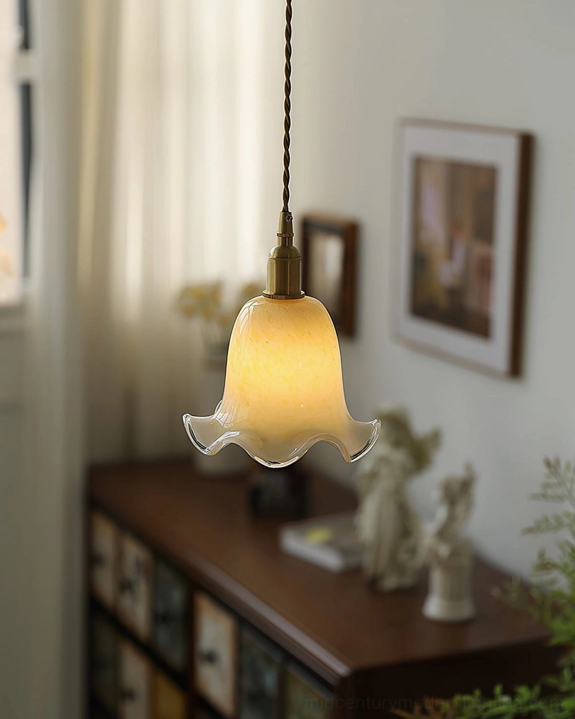 Italian murano handcrafted glass pendant showing translucent warm cream color and ruffled design