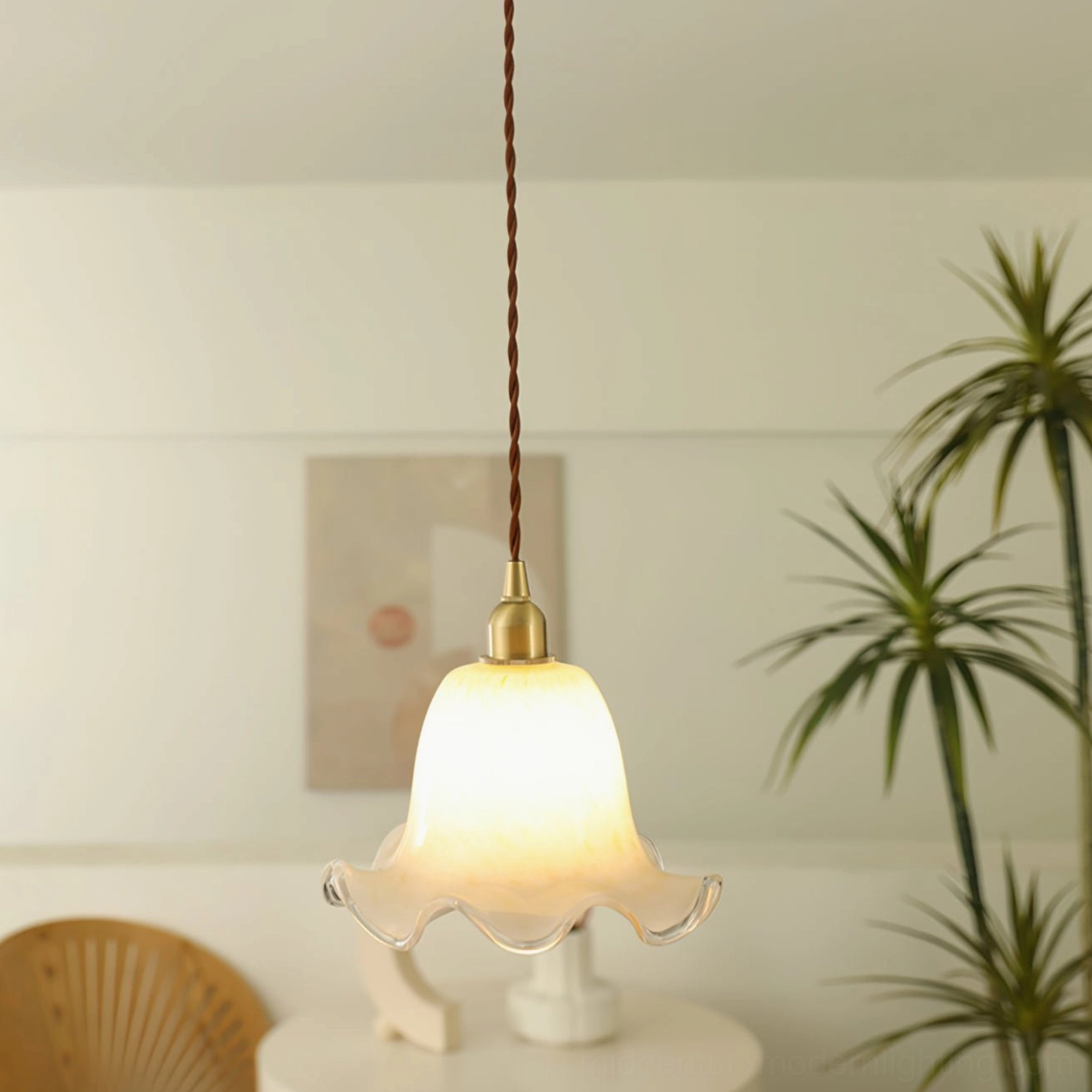 Murano glass pendant light hanging in minimalist vintage-inspired home with side table accent
